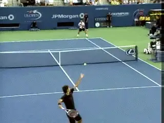 A person hitting a ball with a tennis racket Description automatically generated