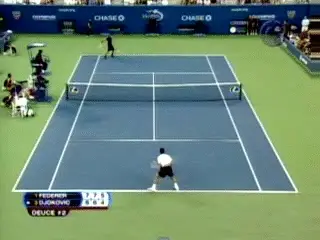 A couple of men playing tennis Description automatically generated with medium confidence