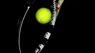 A tennis ball hitting a racket Description automatically generated with medium confidence