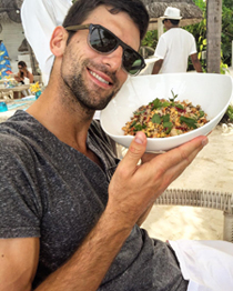 A person holding a bowl of food Description automatically generated
with medium
confidence