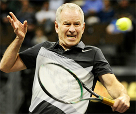 A person holding a tennis racket Description automatically generated