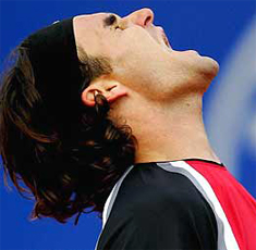 A person with his hair blowing in the wind Description automatically generated with low confidence