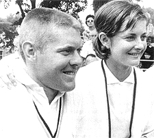 Two people smiling Description automatically generated with medium confidence