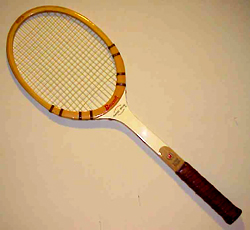 A tennis racket and a ball Description automatically generated with medium confidence